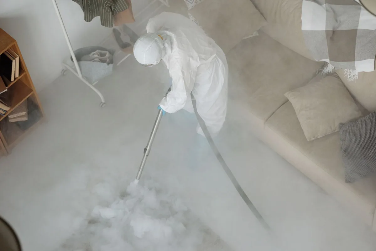 Biohazard cleanup technician in protective equipment, Harpersville, AL